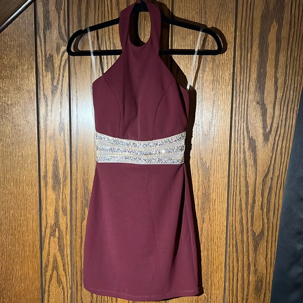Maroon mini dress with a bead/lace design on the front